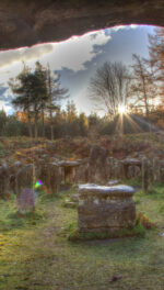 Stones At Druid Temple On Field Against Sky