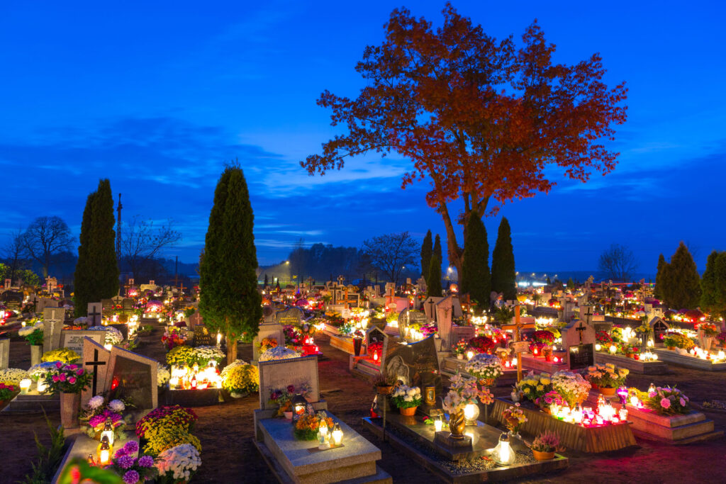 All Soul's Night in Poland Licensed Adobe image of illuminated cemetery in Poland
