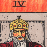 Rider Waite Smith tarot Emperor in red cloak and armor seated on throne
