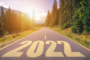 Empty asphalt road and New year 2022 concept. Driving on an empty road in the mountains to upcoming 2022.