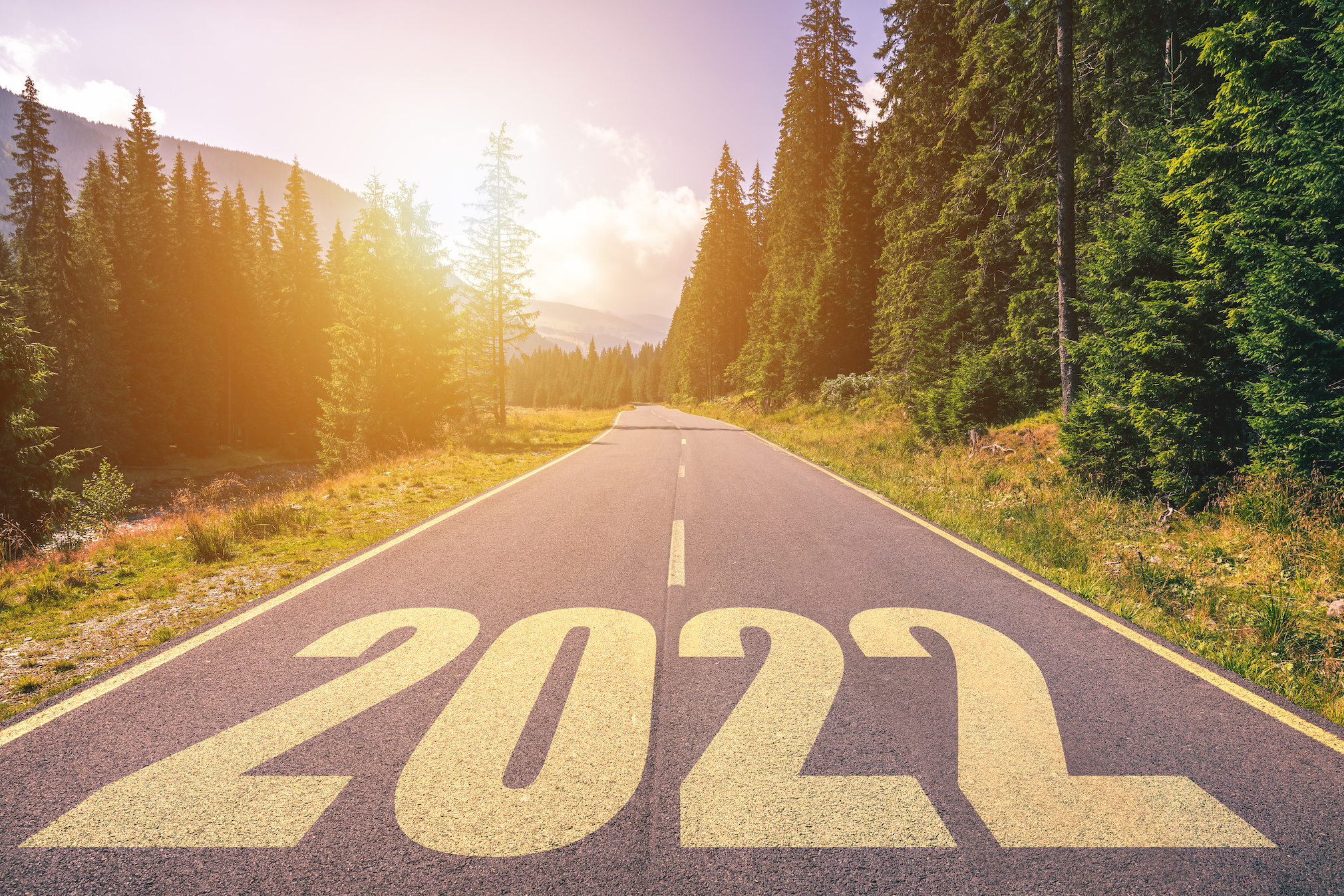 Empty asphalt road and New year 2022 concept. Driving on an empty road in the mountains to upcoming 2022.