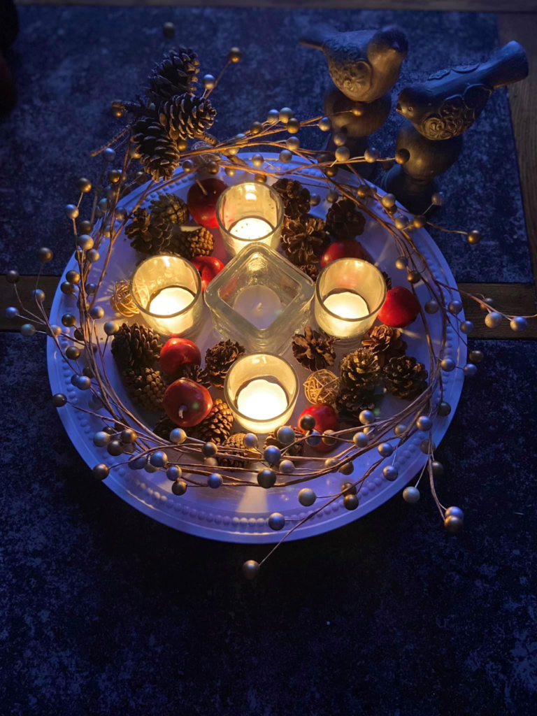 Four of five candles lit from 2020 Ceremony