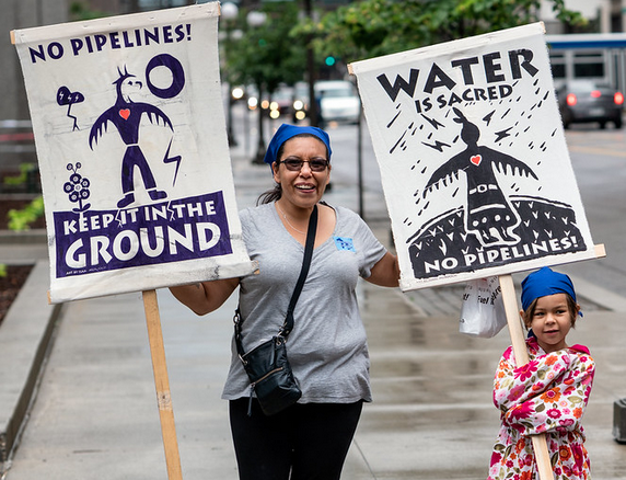 Mother and daughter protesting pipeline water is life