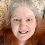 Photo of Diane Wilkes in upholstered chair