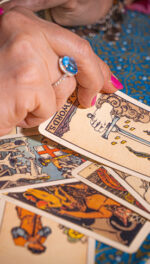 Psychic hand pulling R-W-S cards face up