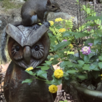 Squirrel and owl carving with flowers