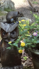 Squirrel and owl carving with flowers