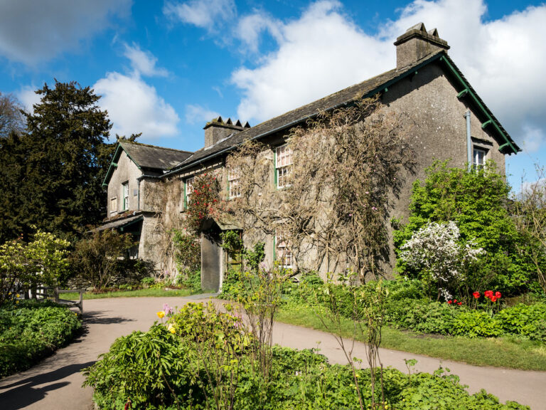 NEAR SAWREY, UK - 23 APRIL 2017: The quaint English country cottage known as Hill Top in the Lake District village of Near Sawrey. The house was once the home of children's author Beatrix Potter.