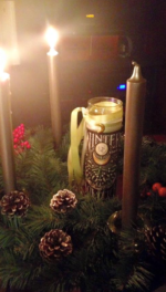 Personal photo from previous Solstice Sun Wreath participant two candles lit