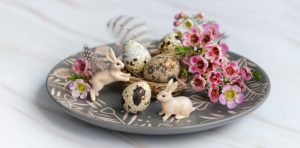 Springtime Ostara image with eggs, flowers and bunnies