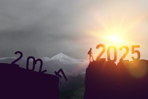 New year 2024 to 2025 written on the mountain top at sunrise