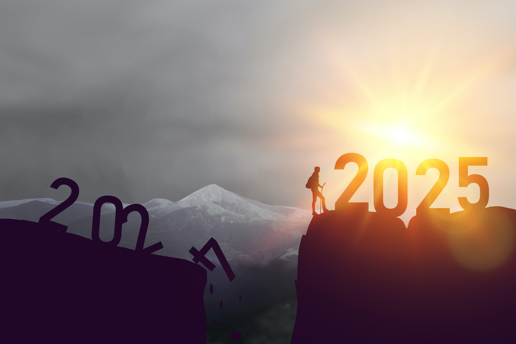 New year 2024 to 2025 written on the mountain top at sunrise