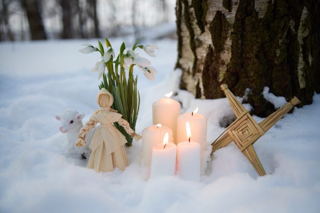 Brighid doll, cross, candles and snowdrops