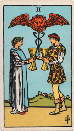 Waite-Smith Tarot two of cups young couple exchanging golden goblets and blessed by lion creature above