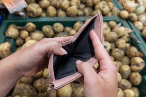 An empty wallet in a grocery store.